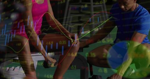 Trainer spotting woman lifting dumbbell with stock charts overlay for fitness data concept