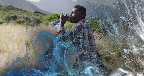 Man Enjoying Outdoor Adventure Amid Fusion of Nature and Digital Art