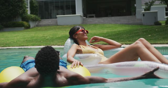 Two Friends Relaxing on Pool Floats in Summer Sun - Download Free Stock Images Pikwizard.com