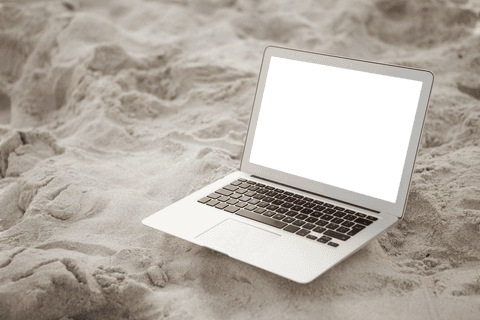 transparent laptop on sandy beach for leisure or remote work - Download Free Stock Videos Pikwizard.com