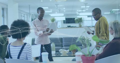 Diverse team collaborating with digital data visualization