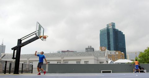 Basketball Player in Action on Urban Rooftop Court
