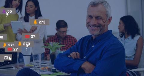 Senior Leader in Office with Digital Notifications Display