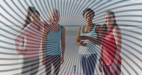 Diverse Women Enjoying Yoga at Beach During Sunny Day