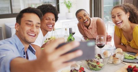 Diverse Friends Enjoying Selfie at Pleasant Dinner