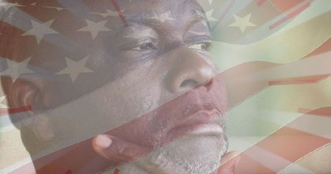 Thoughtful senior man superimposed with united states flag