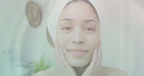 Relaxed woman practicing self-care in soothing bathroom setting