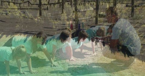 Children engaging in outdoor fitness training with coach