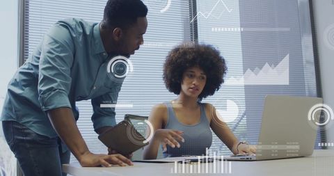 Diverse Team Analyzing Virtual Data in Modern Office