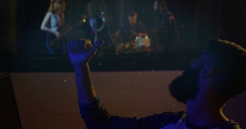 Engineer Monitoring Band Rehearsal Through Soundproof Window