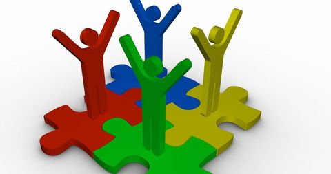 Colorful Team Icons Celebrating on Puzzle Pieces Graphic - Download Free Stock Images Pikwizard.com