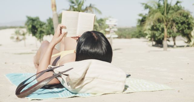 Woman Relaxing on Beach Reading a Book on Sunny Day - Download Free Stock Images Pikwizard.com