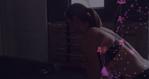 Female athlete leaning in gym silhouette with magenta digital network overlay