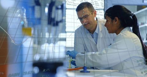Diverse Scientists Collaborating in Modern Laboratory with Data Overlay - Download Free Stock Images Pikwizard.com