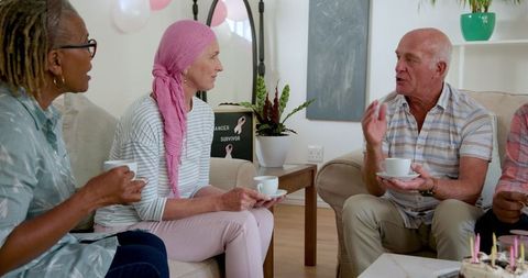 Senior Friends Sharing Coffee and Conversations in Cozy Home Setting