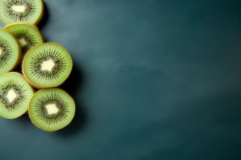 Slices of Fresh Kiwi on Dark Background