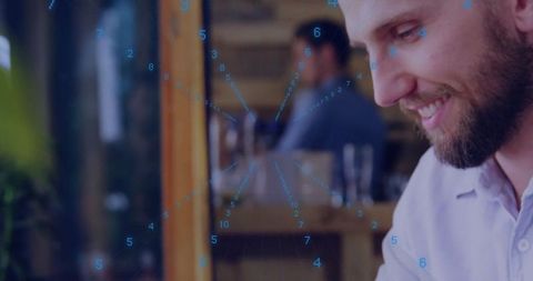 Smiling Professional Analyzing Digital Data Overlaid on Tablet