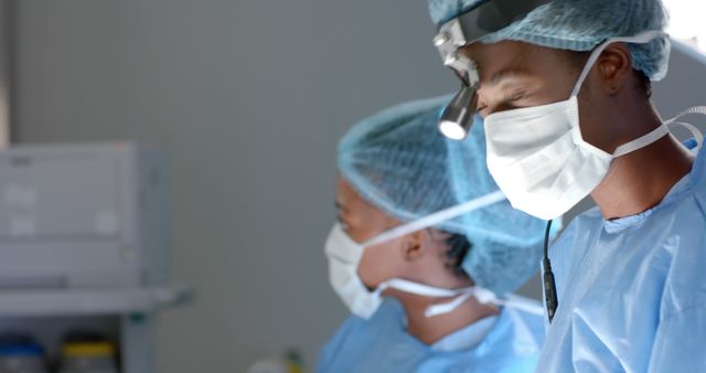 African american female surgeons with face masks during surgery in operating room - Download Free Stock Photos Pikwizard.com