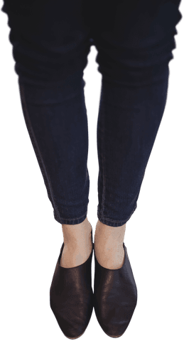 Transparent View of Businesswoman's Legs in Dark Jeans and Shoes