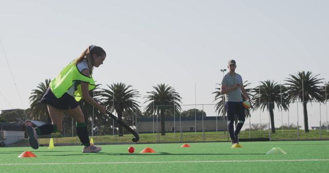 Female Field Hockey Player Training with Coach on Turf Field - Download Free Stock Images Pikwizard.com