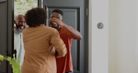 Friends Meeting with Joyful Embrace at Home