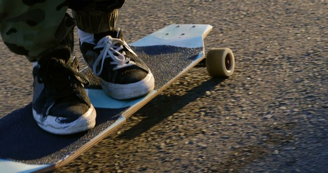 Close-up of Skateboarder Riding Longboard on Street - Download Free Stock Images Pikwizard.com