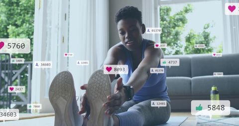 African american woman exercising with social media engagement