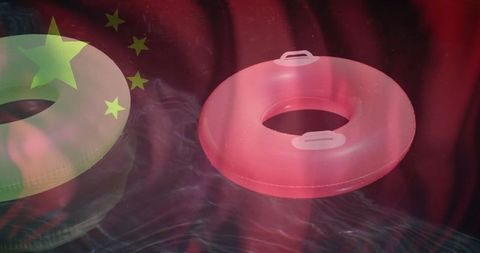 Chinese flag and lifebuoys on water background