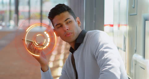 Man Engaging with Futuristic Technology Interface on Smartphone