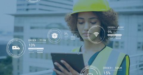 Construction engineer analyzing digital data on building site
