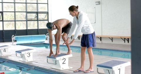 Swimming Coach Training Male Athlete on Diving Technique - Download Free Stock Images Pikwizard.com