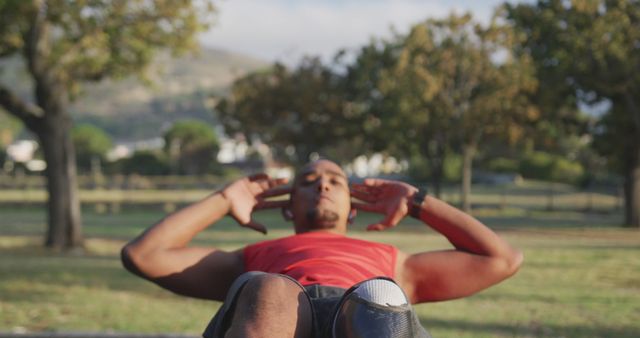 Man Exercising Outdoors Doing Crunches in Park - Download Free Stock Images Pikwizard.com