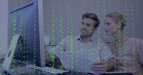 Colleagues collaborating on data analysis with code overlay