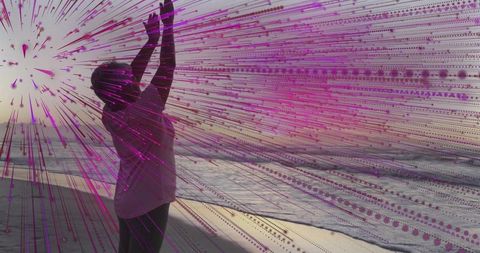 Senior Woman Embracing Sunset with Artistic Flare by Ocean