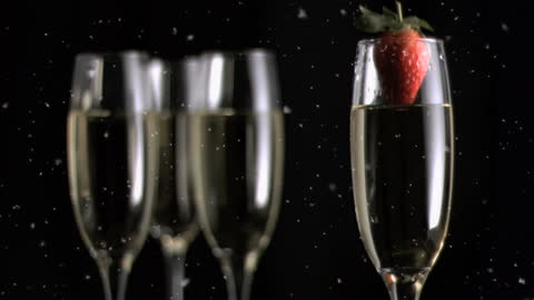 Elegant Champagne Toast with Strawberries and Festive Sparklers