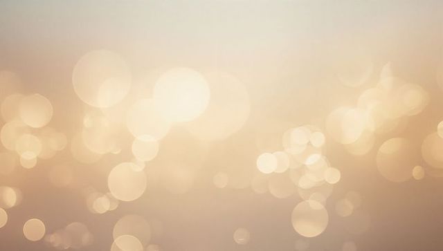 Golden Bokeh Light Orbs Warm Abstract Background with Soft Glow and Ethereal Highlights