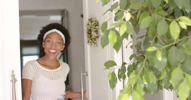 Excited Woman Opening Door in Bright Home Entrnace - Download Free Stock Images Pikwizard.com