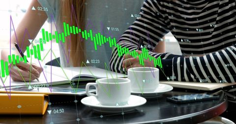 Students Analyzing Financial Data in a Cafe Setting