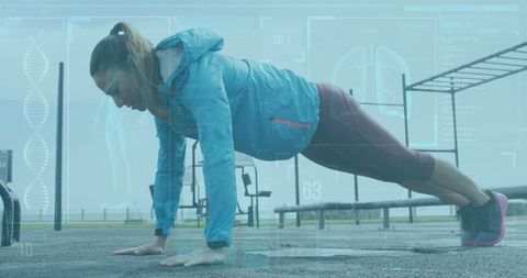 Woman performing push-ups in outdoor gym with futuristic fitness tracker
