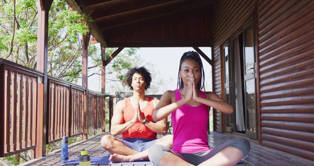 Young Couple Practicing Yoga Meditation on Outdoor Deck - Download Free Stock Images Pikwizard.com