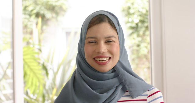 Smiling Woman in Hijab in Bright Room - Download Free Stock Images Pikwizard.com