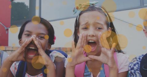 Joyful diverse schoolchildren shouting in unison with digital overlay