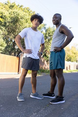 Diverse Friends Bonding During Outdoor Workout on Suburban Street