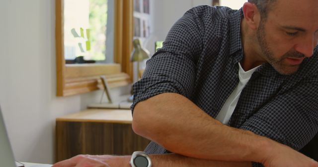 Focused Man Working in Home Office Environment - Download Free Stock Images Pikwizard.com