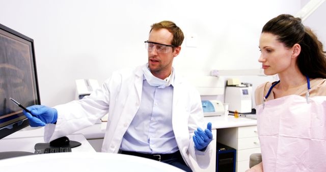 Dentist Explaining X-ray to Patient in Examination Room - Download Free Stock Images Pikwizard.com