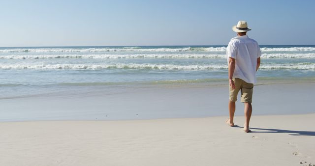 Man Walking on Beach in Casual Summer Attire - Download Free Stock Images Pikwizard.com