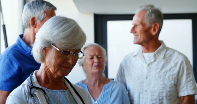 Senior Doctor with Group of Happy Elderly Patients in Clinic - Download Free Stock Images Pikwizard.com