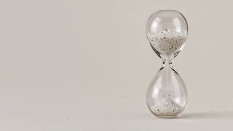 Minimal Hourglass Timer with Speckled Sand on Tabletop