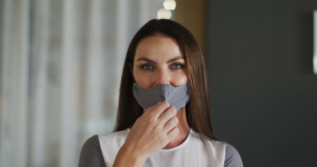 Woman Wearing Face Mask Indoors Looking at Camera - Download Free Stock Images Pikwizard.com