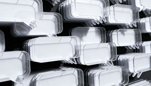 Clear acrylic speech bubble racks in staggered rows reflecting light, geometric pattern